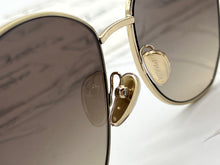 Lade das Bild in den Galerie-Viewer, Luxury Off-Price Fashion by Zapplaz | Prada Sonnenbrille
