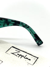 Lade das Bild in den Galerie-Viewer, Luxury Off-Price Fashion by Zapplaz | Prada Sonnenbrille
