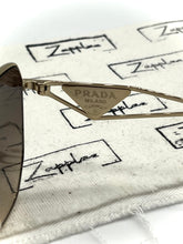 Lade das Bild in den Galerie-Viewer, Luxury Off-Price Fashion by Zapplaz | Prada Sonnenbrille
